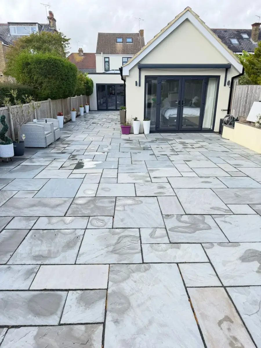 After — moss-covered patio restored with professional pressure washing